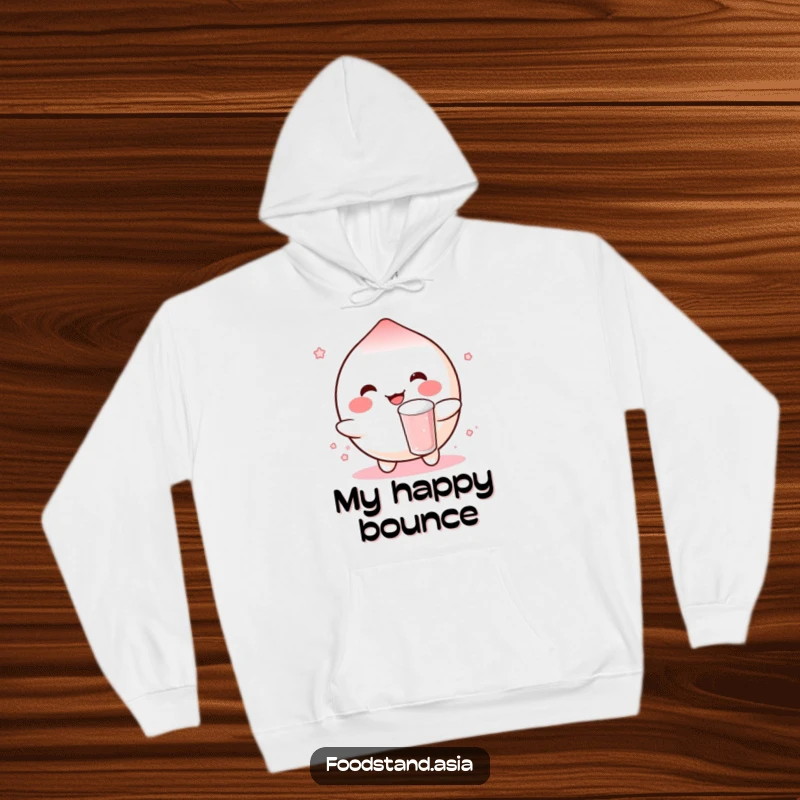 Funny hoodie showcasing a rosy-cheeked mochi character happily bouncing a small boba drink, perfect for cozy, cheerful moments.