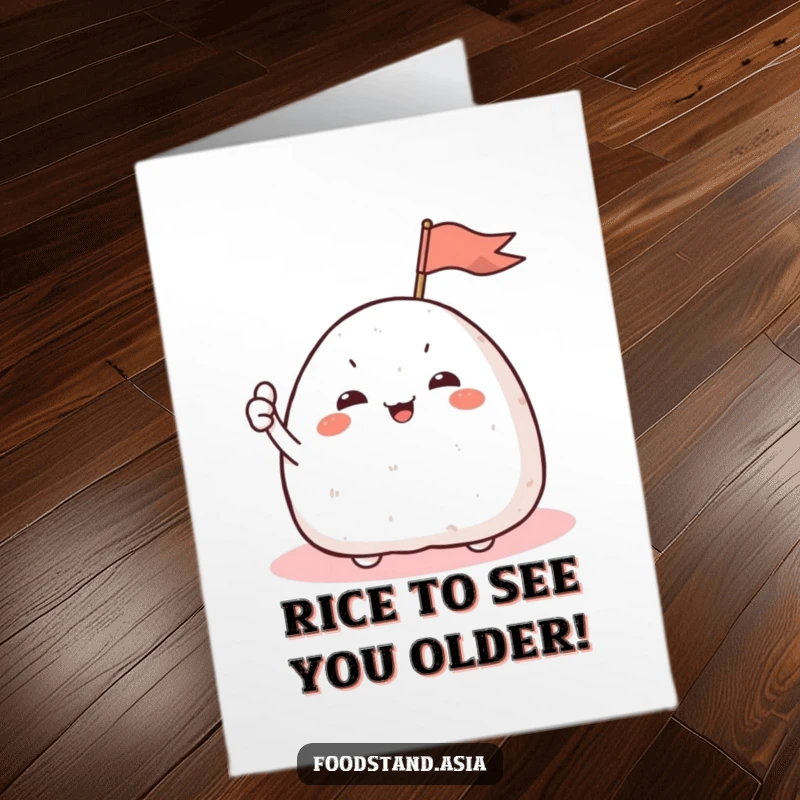 Funny Free Printable Birthday Card featuring a giggling onigiri with small arms waving a tiny flag, perfect for a celebration.